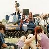 [TITLE: STRATFORD-UPON-AVON, UNITED KINGDOM - JULY 1996: Festival goers gather at a tank, converted into a dance music sound-system by the Super Furry Animals, during the 1996 Phoenix Festival, held from 18 to 21 July at Long Marston, Stratford-Upon-Avon. (] [AUTHOR: Jim Dyson] [SOURCE: Getty Images]